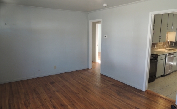 Living room looking toward kitchen and hallway doorway